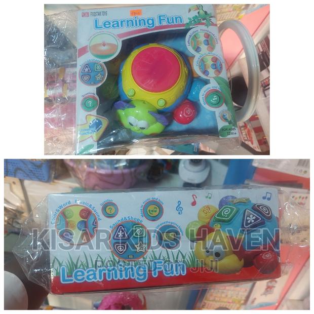 Kids Learning Toy(
Sound and Shape
Letters and Colours
Music · Photo 1