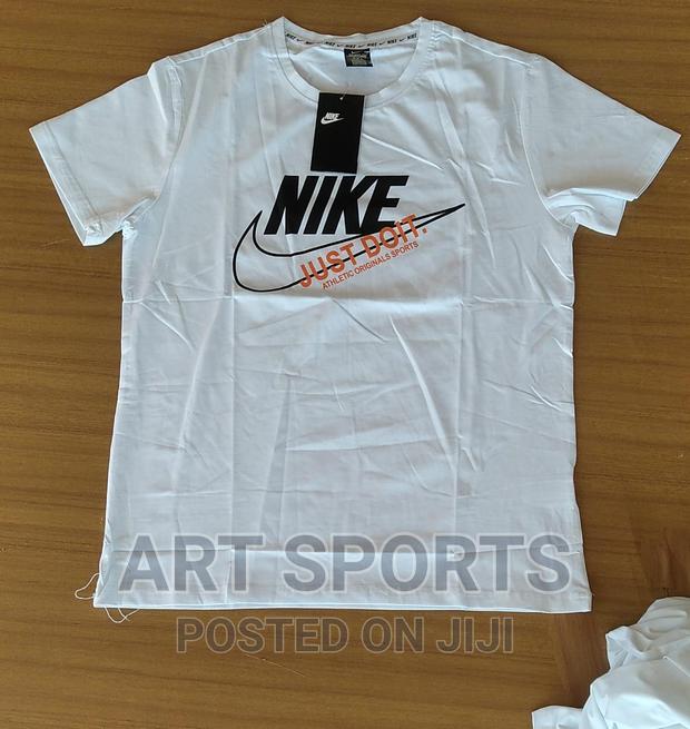Nike Tops . · Photo 1
