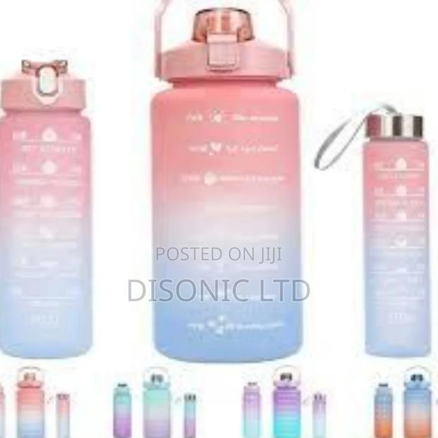 A Set of 3 School Children Drinking Water Bottles · Photo 1