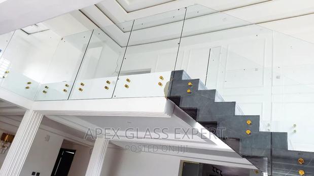 Staircase Glass With Gold Railing Support. · Photo 2
