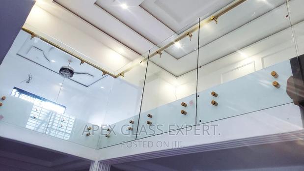 Staircase Glass With Gold Railing Support. · Photo 5