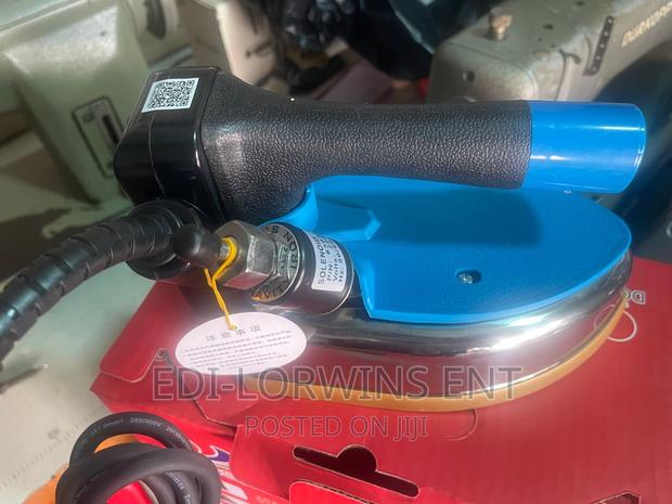 Dongsung Industrial Gravity Steam Iron · Photo 1