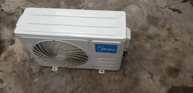 1.5 R-410 Midea Outdoor Unit · Photo 1