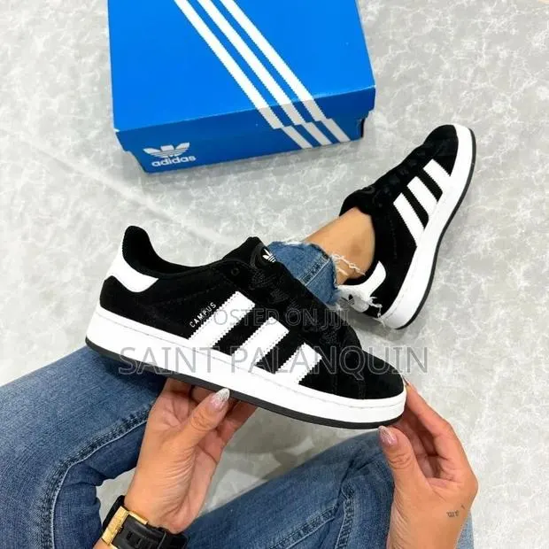 The Image Shows a Pair of Black and White Adidas Campus Sneakers · Photo 1