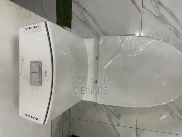 Ceramic Water Closet- Slim Tank. S-Trap and P-Trap Available · Photo 1