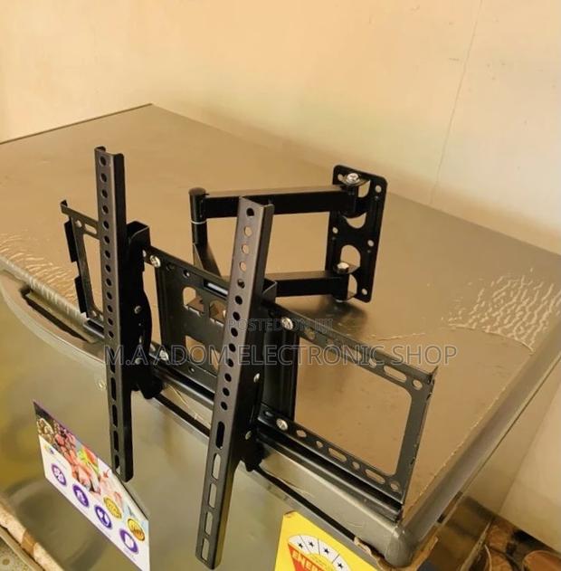 Adorable Adjustable Corner Tv Mount for 32”-55”(Black). · Photo 1