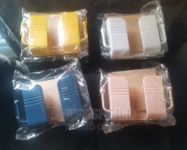 Adhesive Phone and Remote Wall Mount · Photo 1