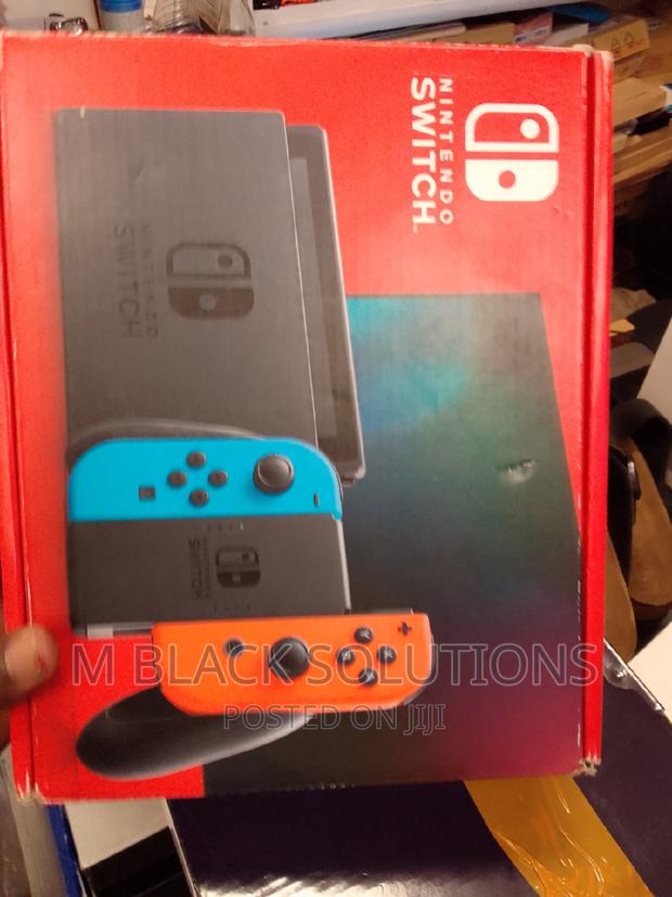 New Nintendo Switch With Blue and Red Joy-Con · Photo 1