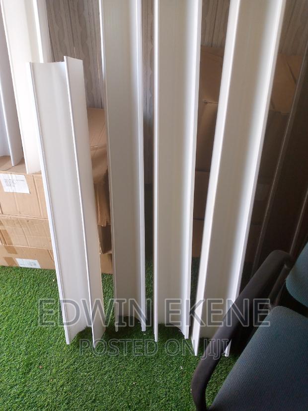 White PVC Rain Gutter and Down Pipe · Photo 1