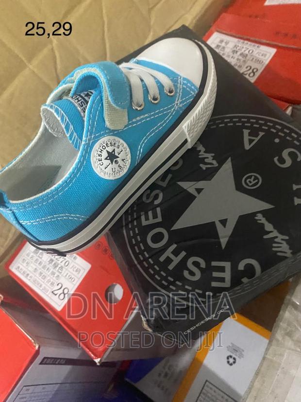 Kids All Stars Sneakers Neatly in a Box · Photo 1