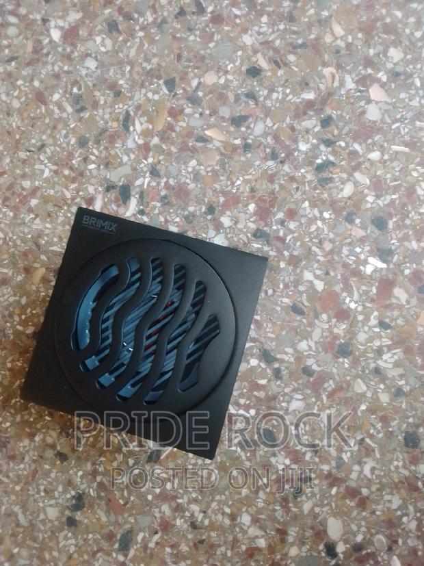 Black Metal Antitrust Floor Drain · Photo 4