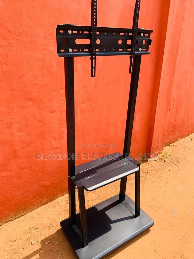 Long Lasting Mobile Tv Stand for 32”-75” Tv. · Photo 1