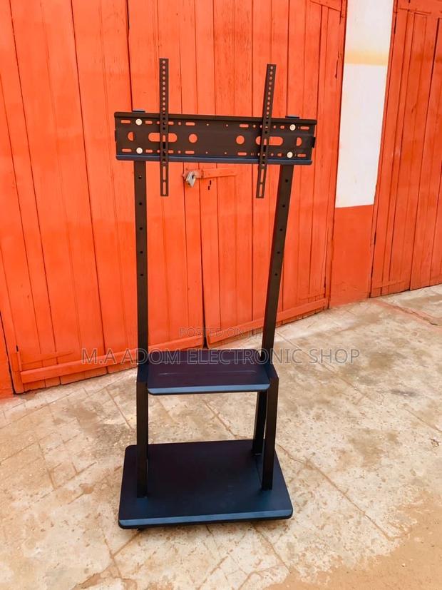 Affordable Mobile Tv Stand With Wheels for 32”-75” Tv · Photo 1