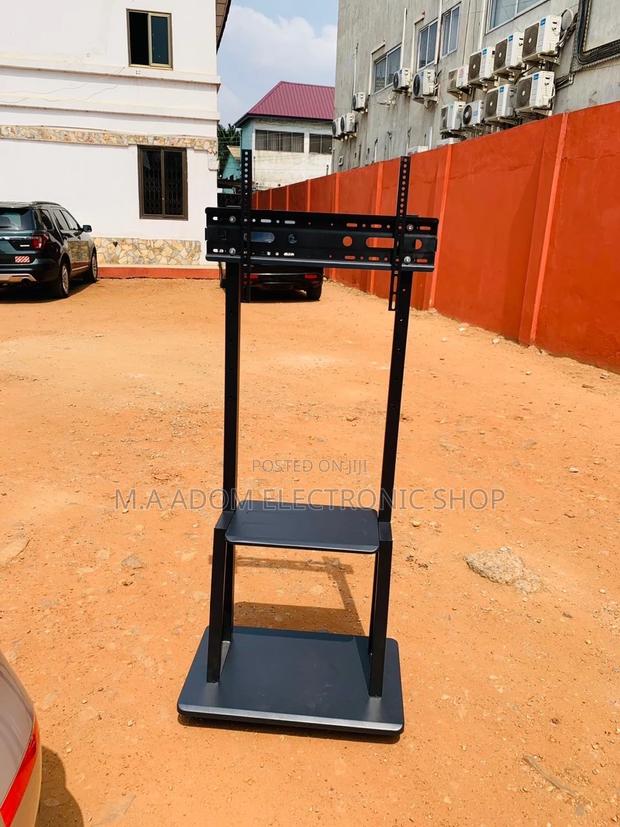 Durable Mobile Tv Stand With Wheels for 32”-75” Tv · Photo 1
