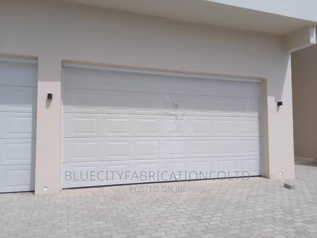 American Automated Garage Door 14ft X 8ft · Photo 1