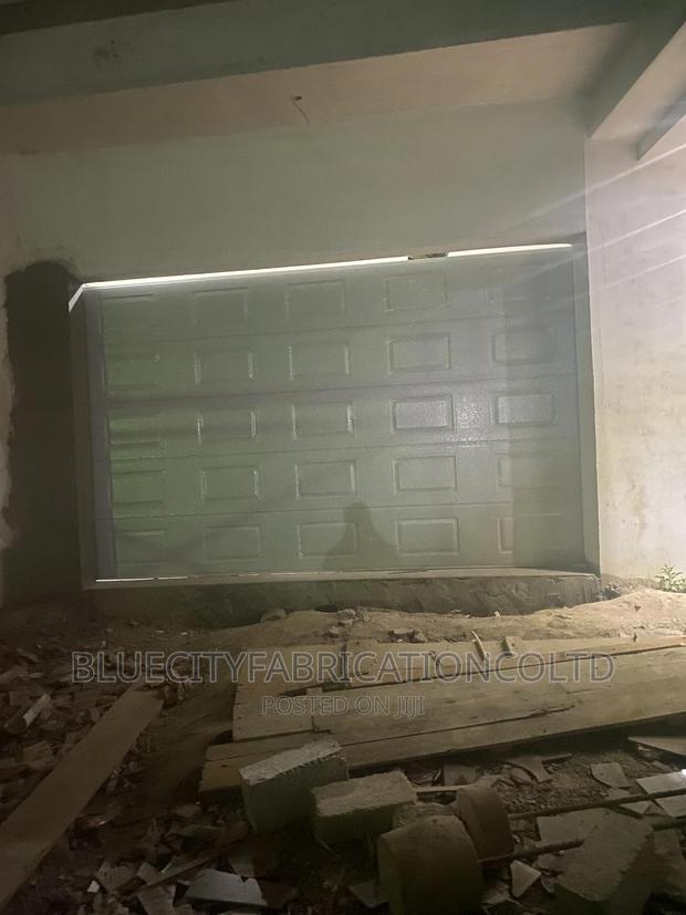 Car Automated Garage Door · Photo 1