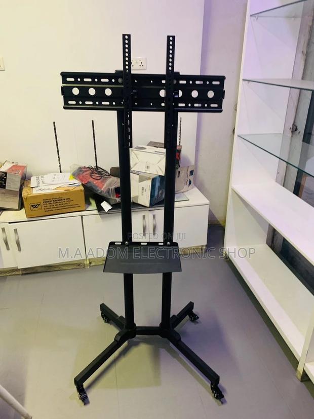 Durable and Affordable Moveable Tv Trolly for 32”-65”. · Photo 1
