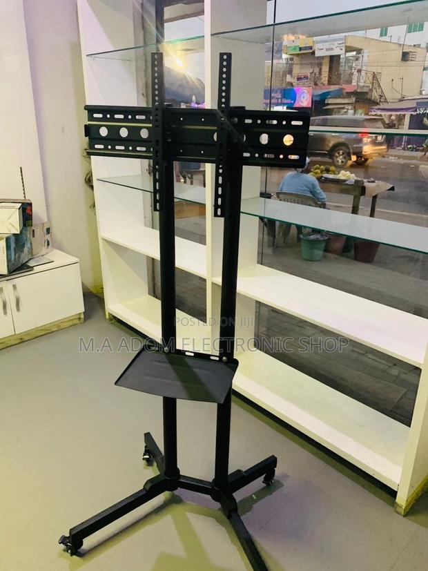 Sealed in Box Moveable Tv Trolly for 32”-65 Inch Tv,Black. · Photo 1