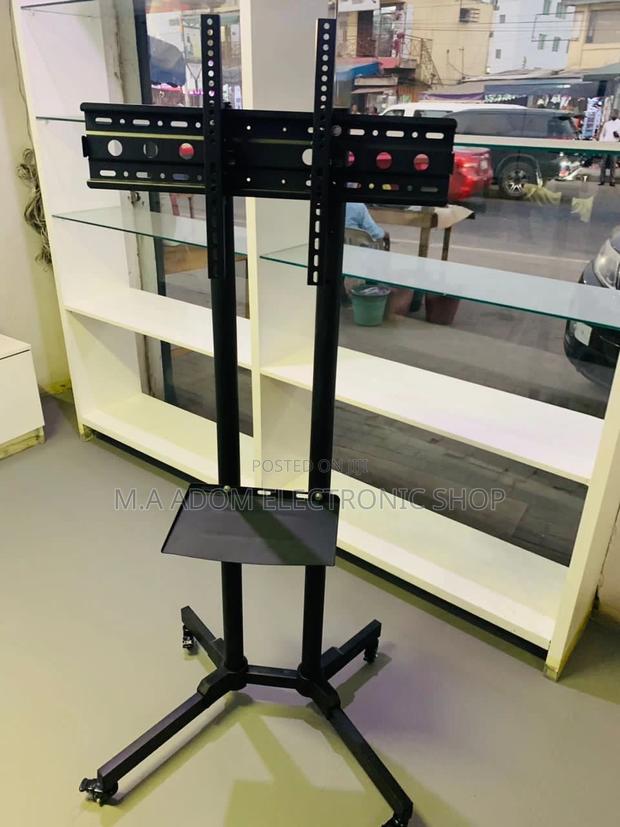 Newly in Stock Moveable Tv Trolly for 32” to 65 Inch Tv. · Photo 1