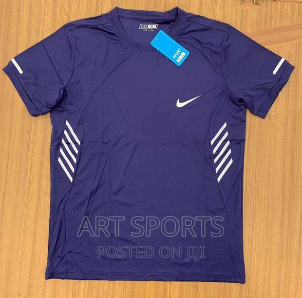 Nike Running Tops · Photo 1