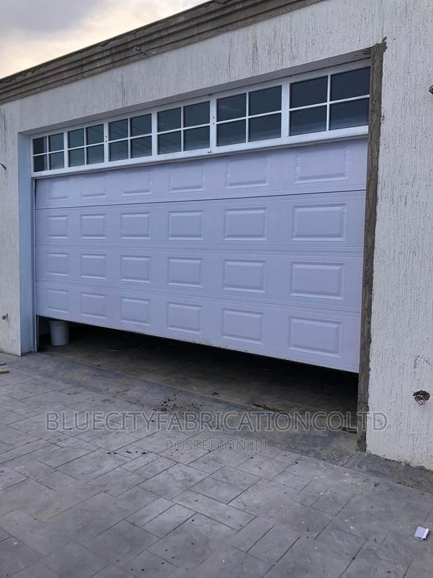 American Automated Garage Door and Fanlight on Top 16ft X8ft · Photo 2