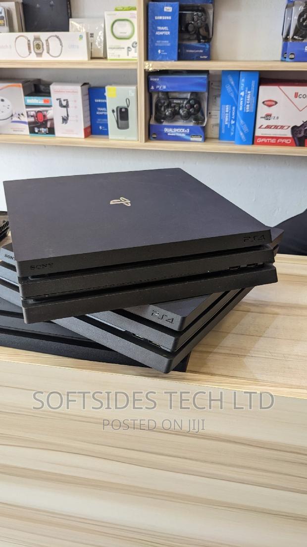 Playstation 4 Pro and Controller With Hdmi, Charger, · Photo 3