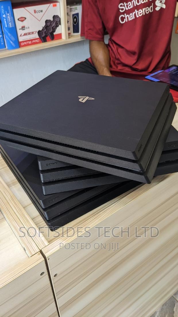 Playstation 4 Pro and Controller With Hdmi, Charger, · Photo 1