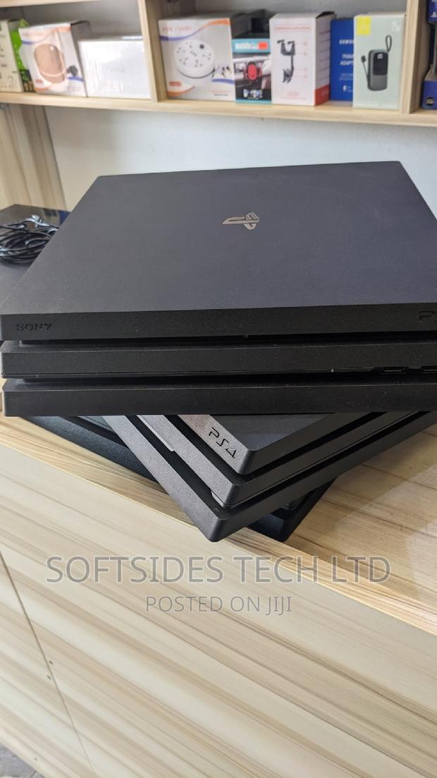 Playstation 4 Pro and Controller With Hdmi, Charger, · Photo 2