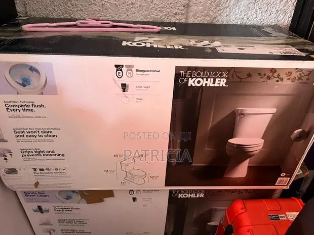 New Kohler Elongated Chair Height Toilet With Soft-Close Seat · Photo 1