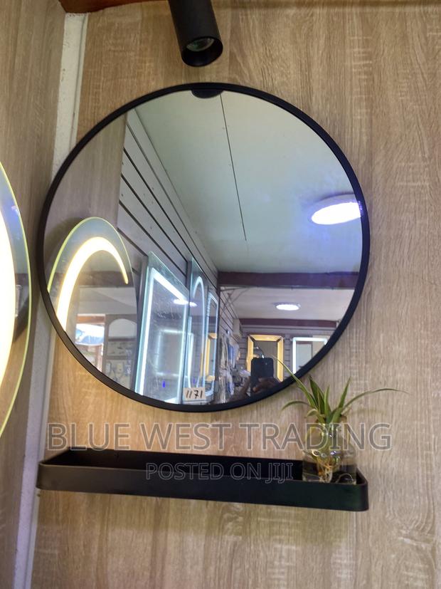 Decorative Round Miror With Black Shelves (60 CENTIMETERS) · Photo 1