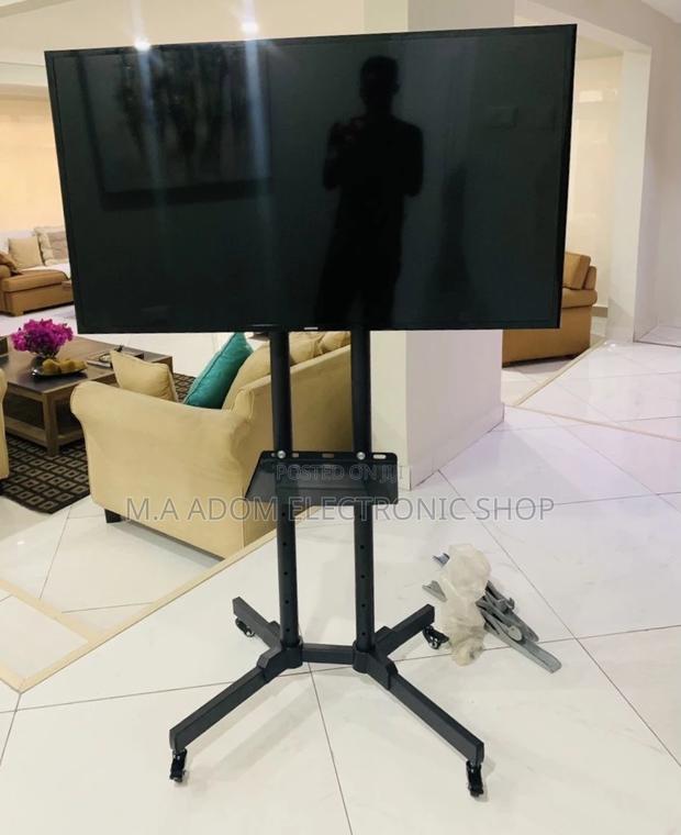 Brand New Moveable Tv Trolly for 32”-70 Inch Tv(Black). · Photo 1