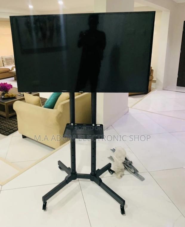 Sealed in Box Moveable Tv Trolly for 32”-70 Inch Tv(Black). · Photo 1