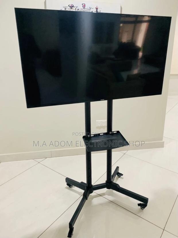 Stainless Steel Moveable Tv Trolly for 32”-70” Tv,Black. · Photo 1