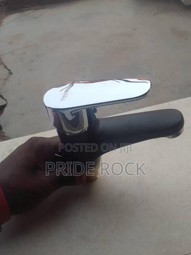 Black and Chrome Single Lifted Black and Chrome Basin Tap · Photo 1