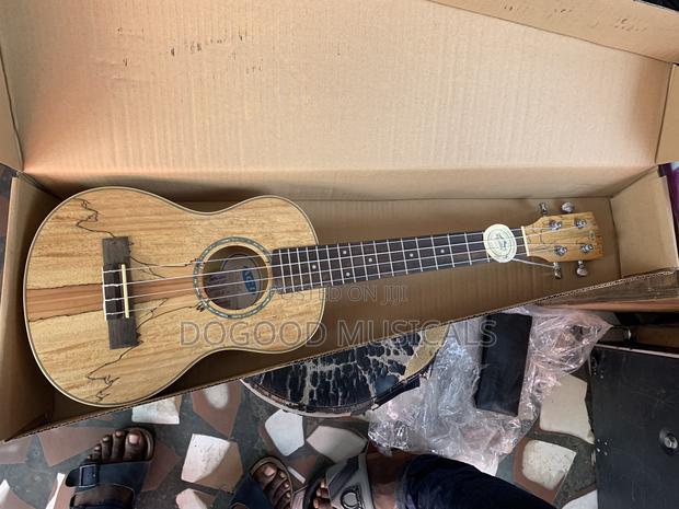 Acl Ukulele Guitar · Photo 1