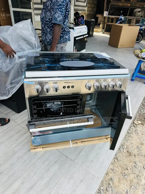 Available Now at Store Gas Cooker Oven Rotisserie 60/90 5burner · Photo 1