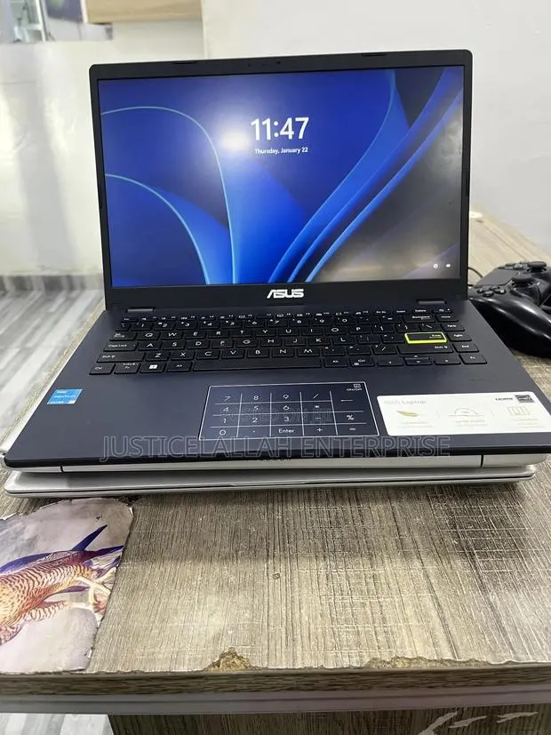 Laptop Asus Vivobook E410M 4GB Intel Pentium SSD 60GB · Photo 1