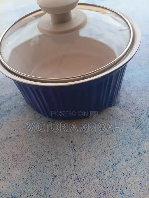 A Glossy Blue Ceramic Ramekin. · Photo 1