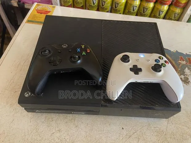 Xbox One With 2 Controllers Loaded With Games · Photo 1