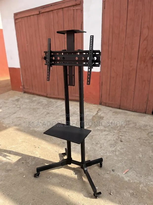 Rolling Tv Cart With With Lockable Wheels 32”-70” · Photo 1