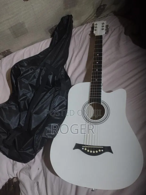 Acoustic Guitar With Tuner and Bag · Photo 1