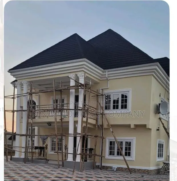 Yellow House Roofed With Quality Euro Roofing Tiles · Photo 1