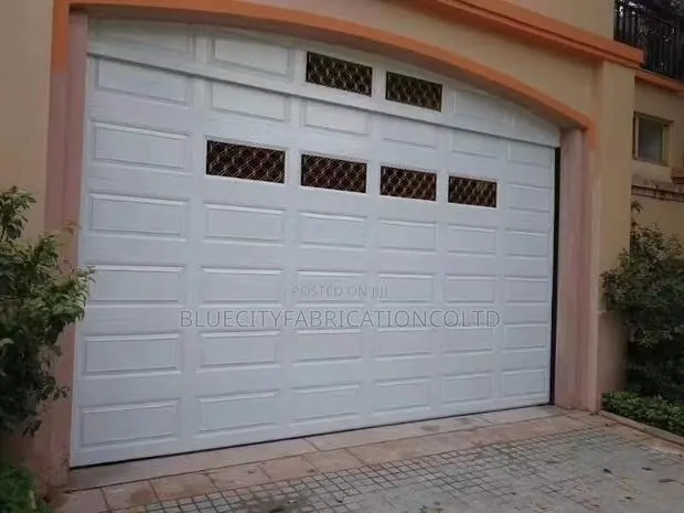 Sectional Garage Doors With Automatic Motor and Two Remote · Photo 1