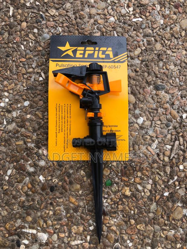 Automatic Rotating Garden Sprinkler-Stick to Ground · Photo 1