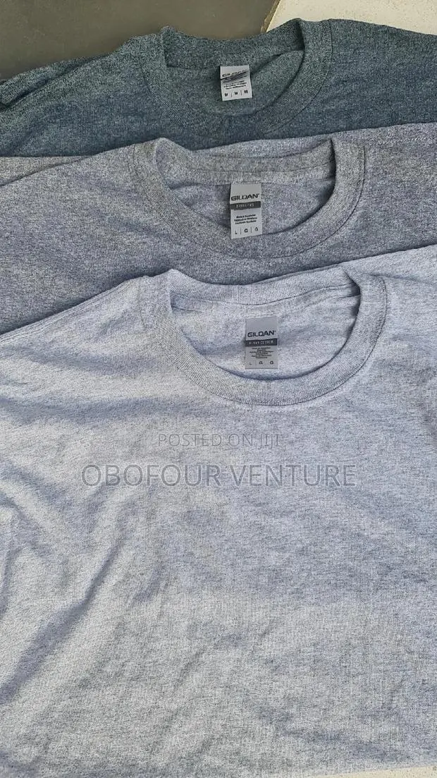 Quality Unisex T-Shirts. %£ At · Photo 1