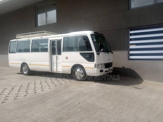Car Rental- 29 Seats Bus- Toyota Coaster Bus for Rent · Photo 1