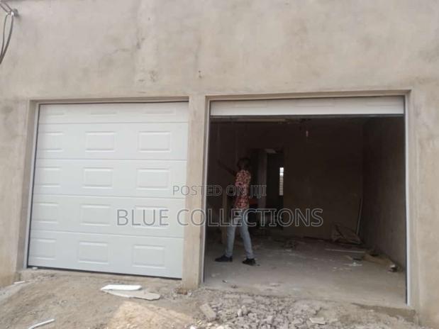Double Door Automated Garage Door · Photo 1