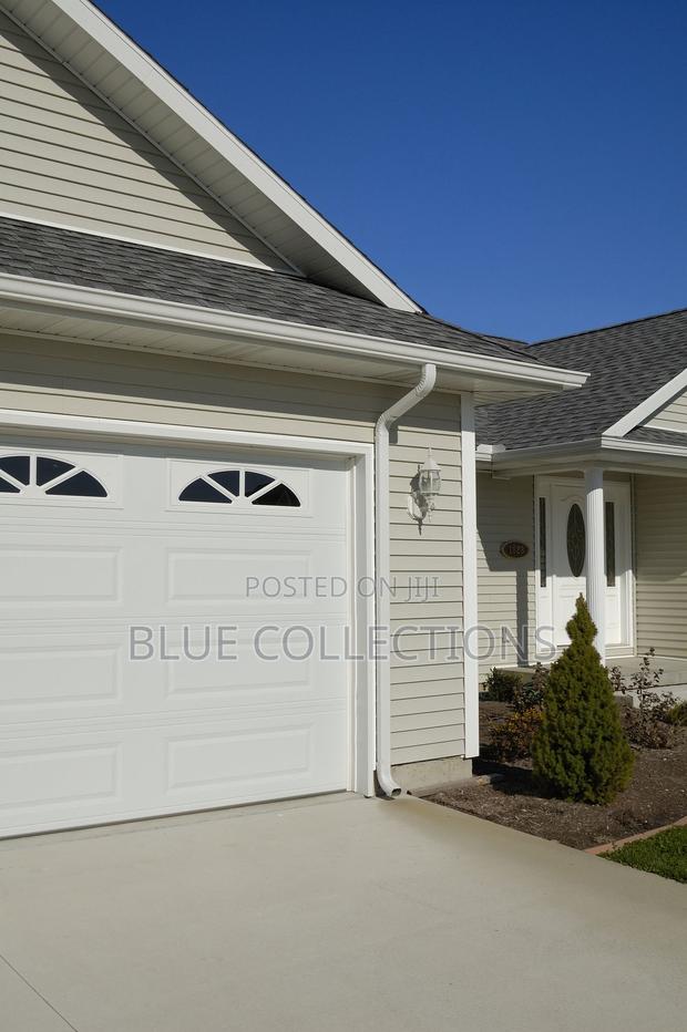Canada Automated Garage Door With Remote and Fanlight · Photo 1