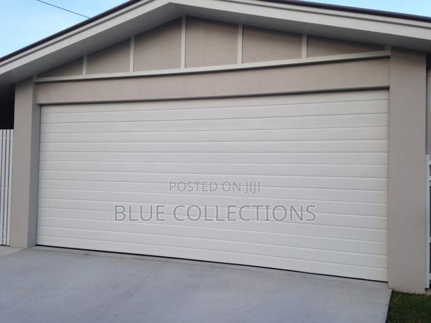 Automated Garage Doors With Remot · Photo 1