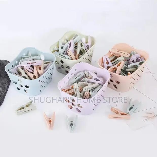 30pcs Plastic Clothes Pegs in a Basket · Photo 4